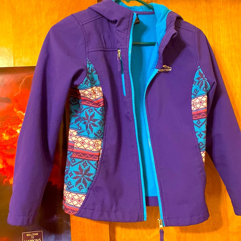Purple light winter jacket. Has a snowflake pattern on the sides.